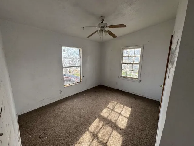 a view of an empty room and window