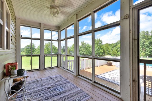 a view of a balcony with chairs