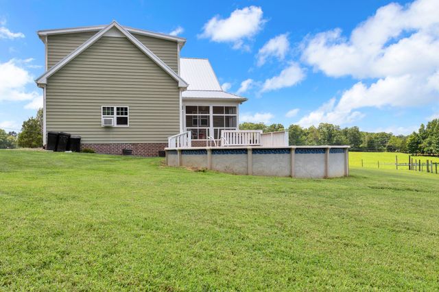 a bathroom with a shower and a sink