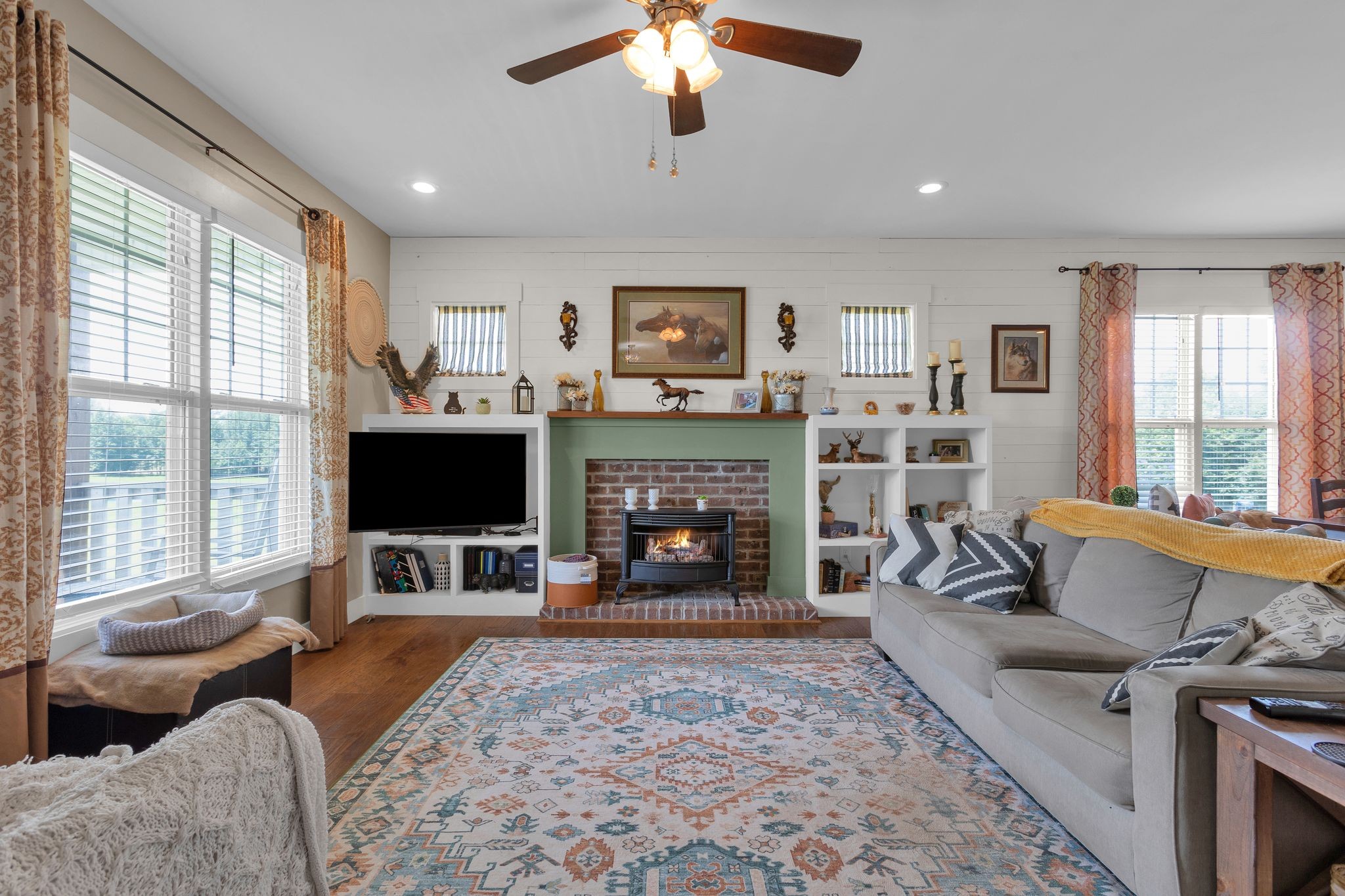 828 Wills Road Dickson, TN 37055 - Photo 8 of 53 a living room with furniture a flat screen tv and a fireplace