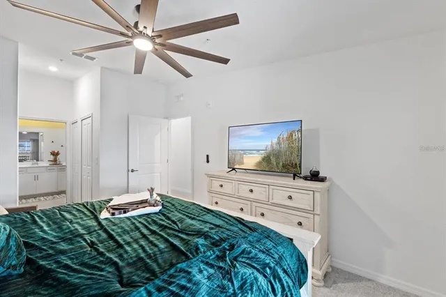 a bedroom with a bed and a lamp