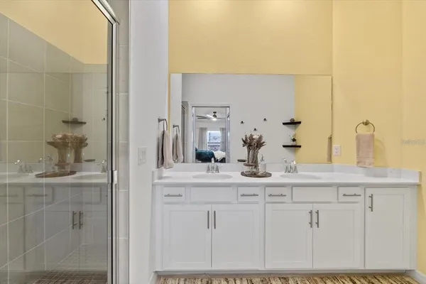 a bathroom with a sink a toilet and shower curtain