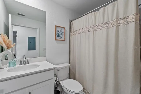 a swimming pool with trees in the background