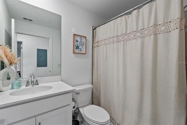 a swimming pool with trees in the background