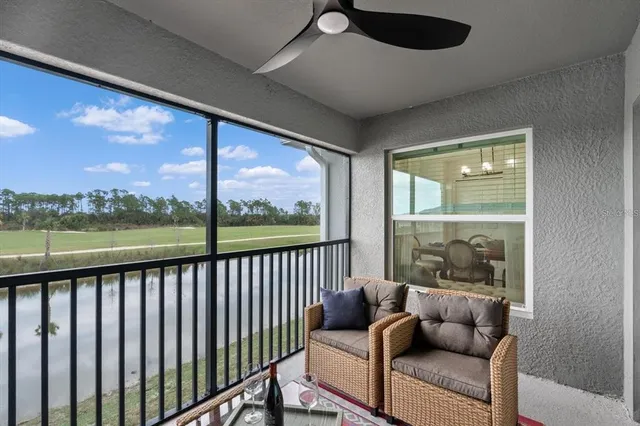 a view of a house with backyard porch and sitting area