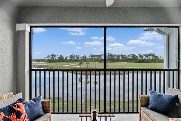a view of a golf course with an ocean