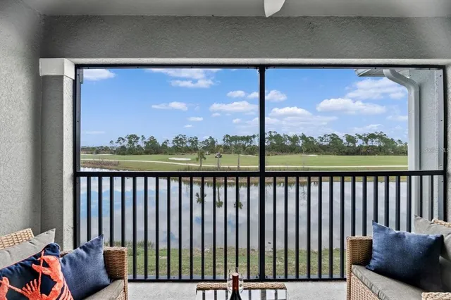 a view of a golf course with an ocean