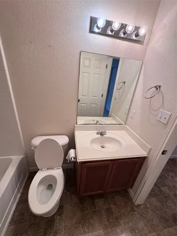 a view of room with wooden floor