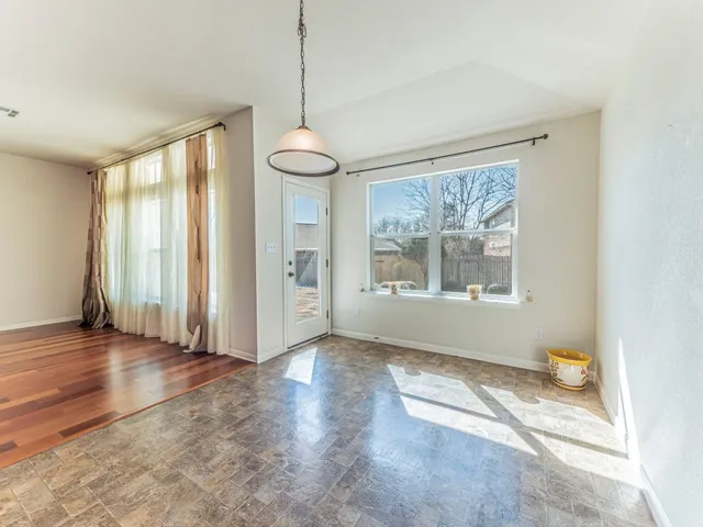 a bathroom with a granite countertop sink and a large mirror