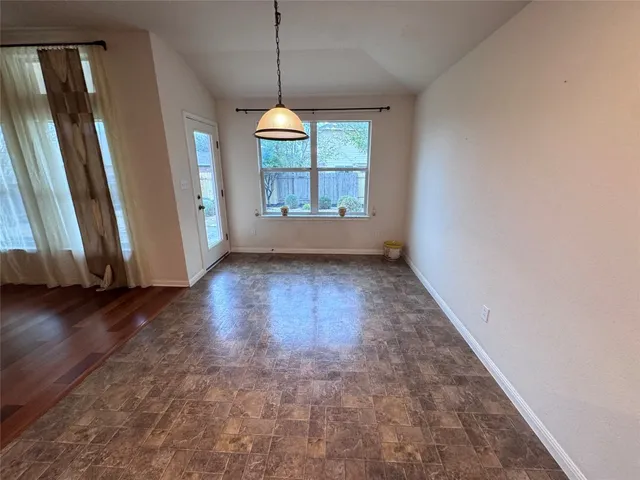 a open kitchen with a sink a microwave and a refrigerator