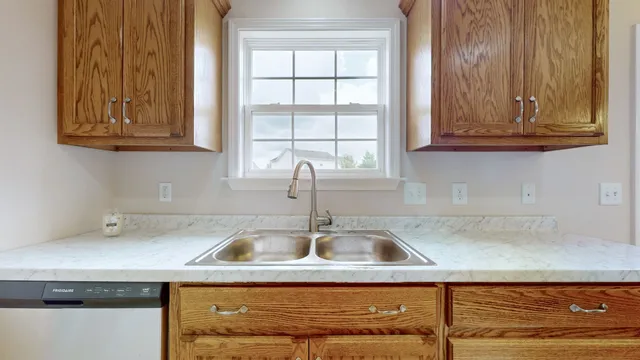 a kitchen with a sink and cabinets