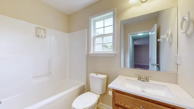 a bathroom with a sink toilet and bathtub