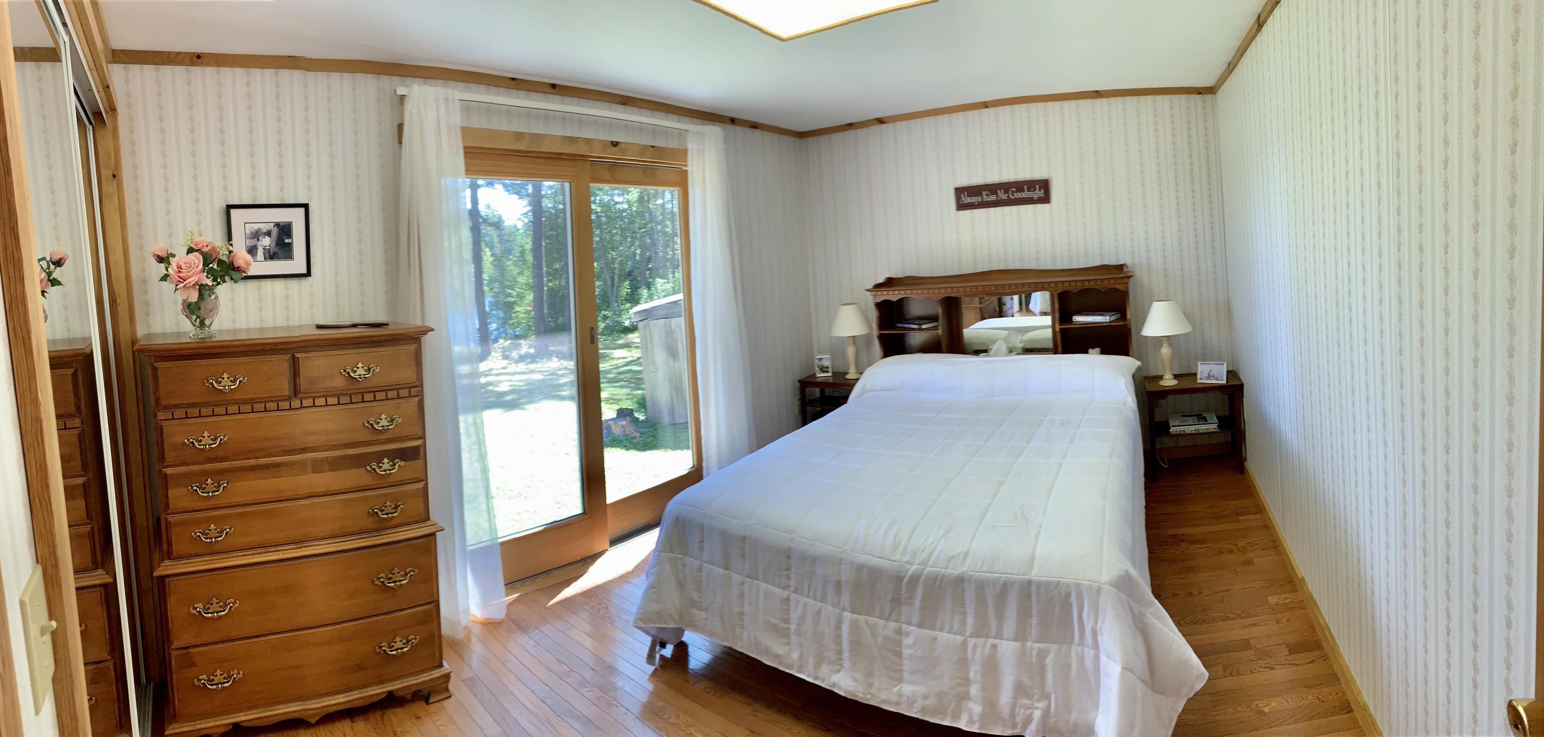 277 Shore Rd Lake View North Milo, ME 04463 - Photo 30 of 59 Hardwood Floors & Patio Door in Master