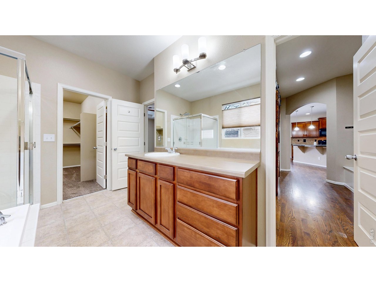 5543 Calgary Street Timnath, CO 80547 - Photo 13 of 39 Primary Bathroom with Walk-In Closet (Main Level)