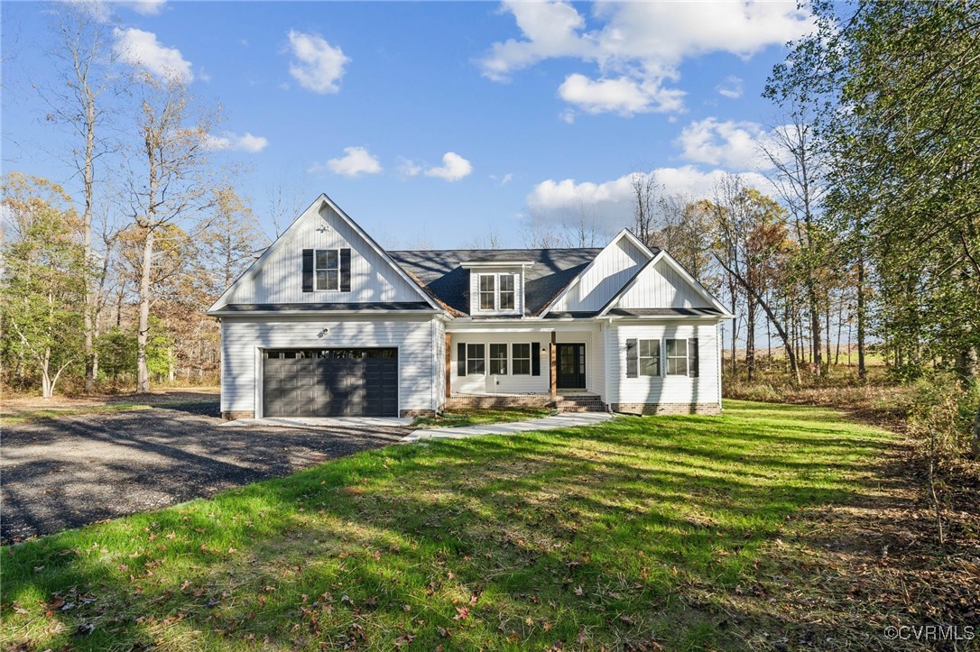 15165 Rice Road Beaverdam, VA 23015 - Photo 1 of 1 a front view of a house with a garden