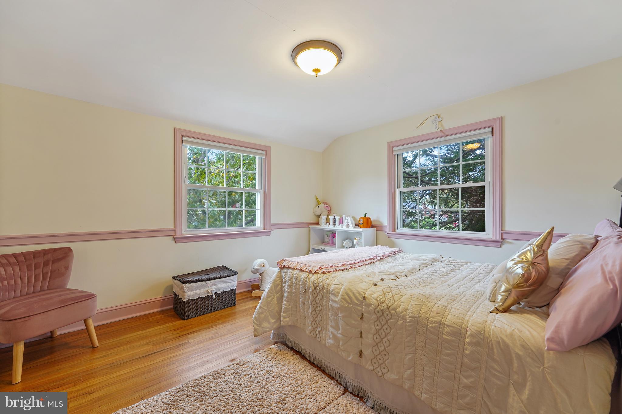 311 Avon Road Springfield, PA 19064 - Photo 17 of 38 a bedroom with a bed and a window