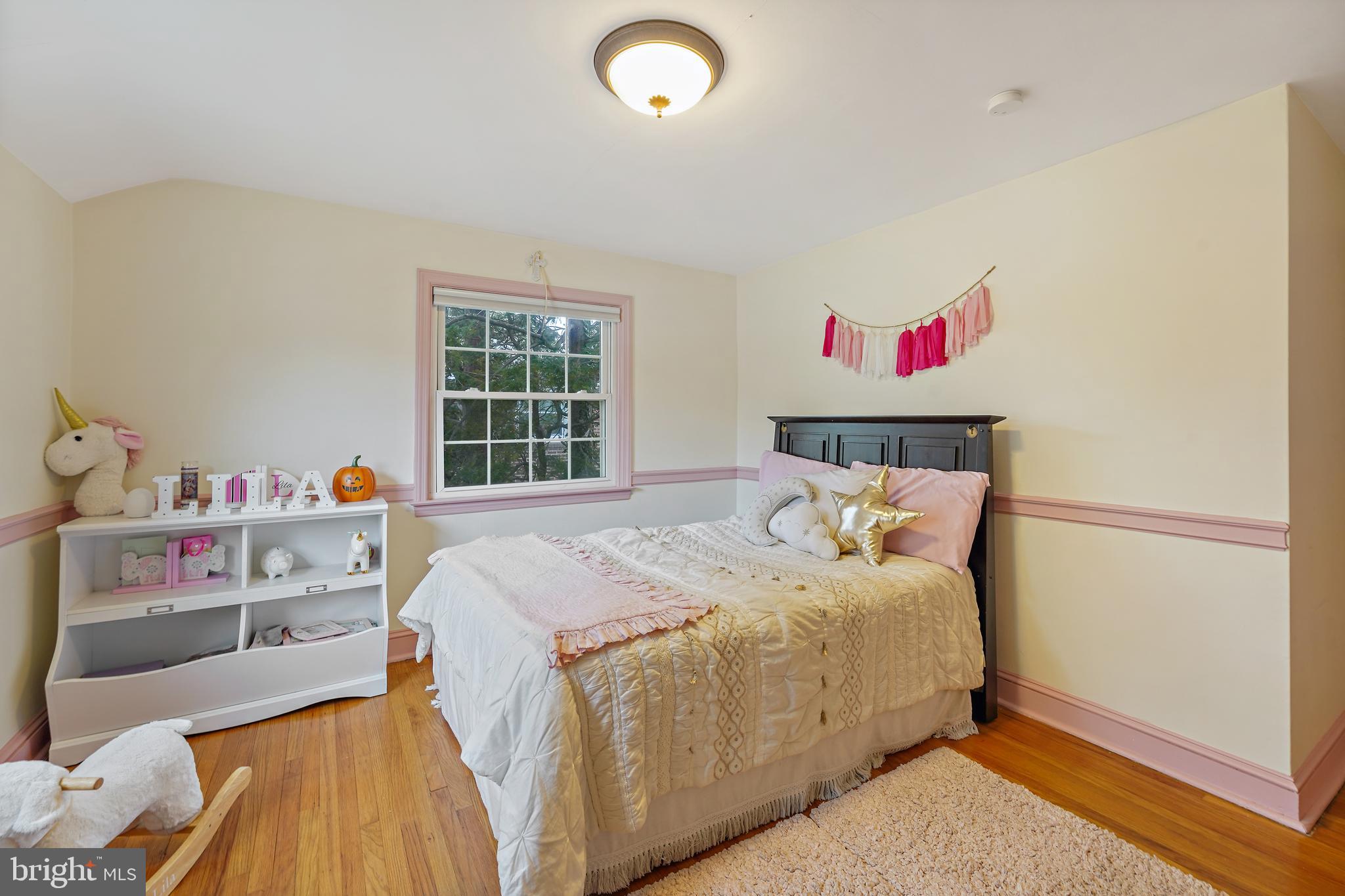 311 Avon Road Springfield, PA 19064 - Photo 18 of 38 a bedroom with a bed and a window