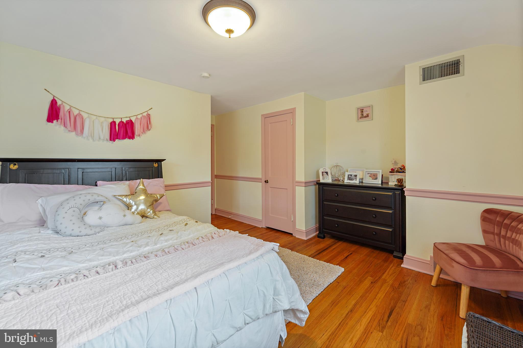 311 Avon Road Springfield, PA 19064 - Photo 19 of 38 a bedroom with a bed and a book shelf