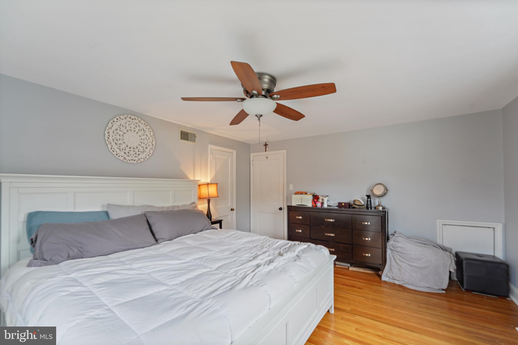 311 Avon Road Springfield, PA 19064 - Photo 22 of 38 a bedroom with a bed and wooden floor