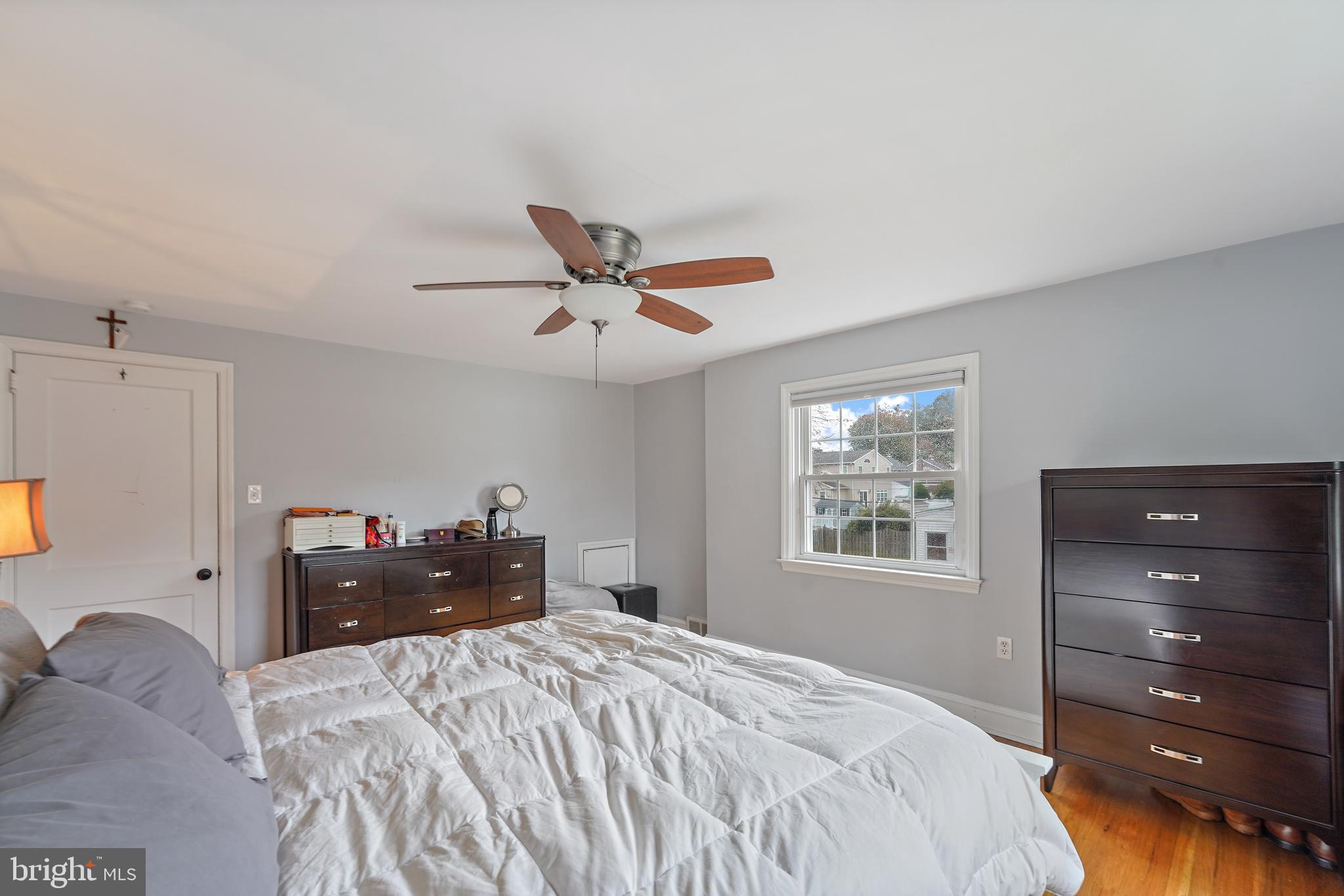 311 Avon Road Springfield, PA 19064 - Photo 23 of 38 a bedroom with a bed and wooden floor