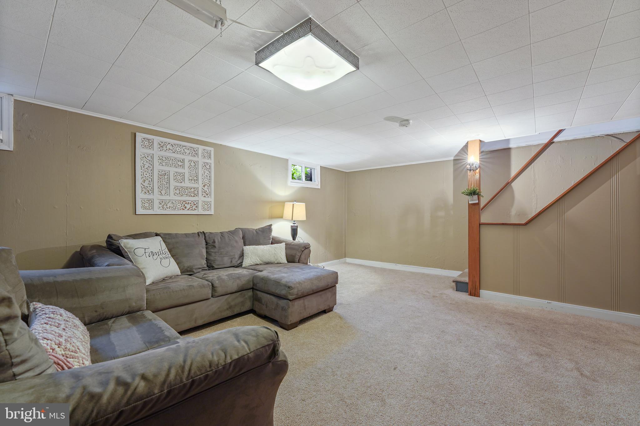 311 Avon Road Springfield, PA 19064 - Photo 29 of 38 a living room with furniture and a window