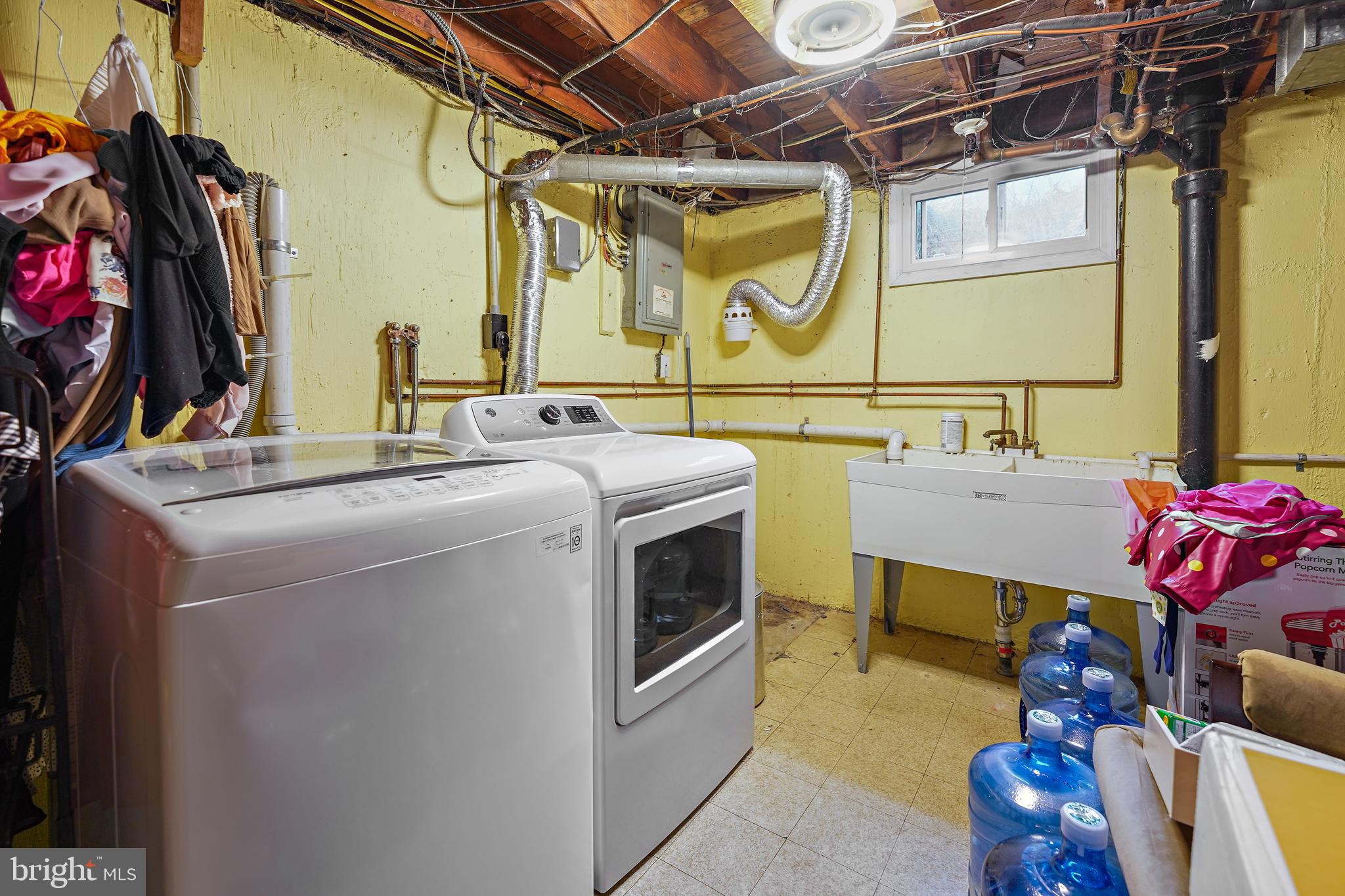 311 Avon Road Springfield, PA 19064 - Photo 31 of 38 a utility room with dryer and washer