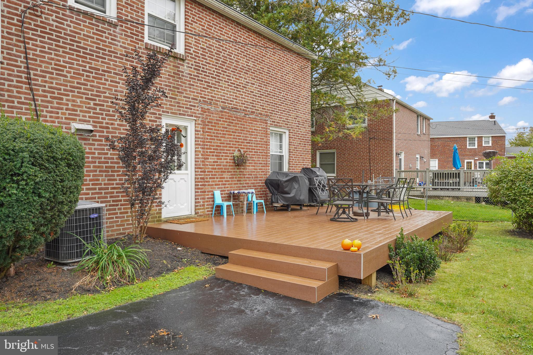 311 Avon Road Springfield, PA 19064 - Photo 33 of 38 a view of backyard with swimming pool and seating space