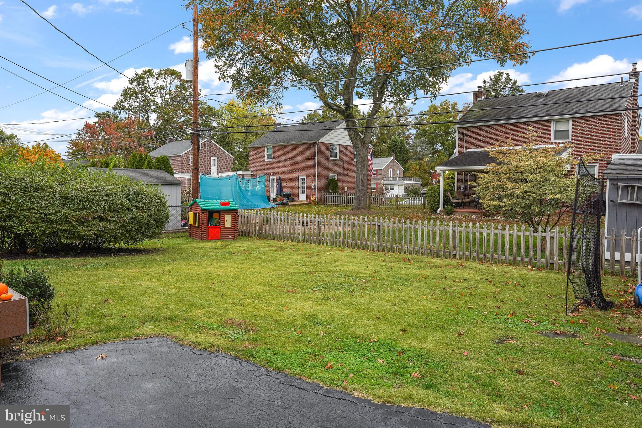 311 Avon Road Springfield, PA 19064 - Photo 36 of 38 a view of a house with a yard and a tree
