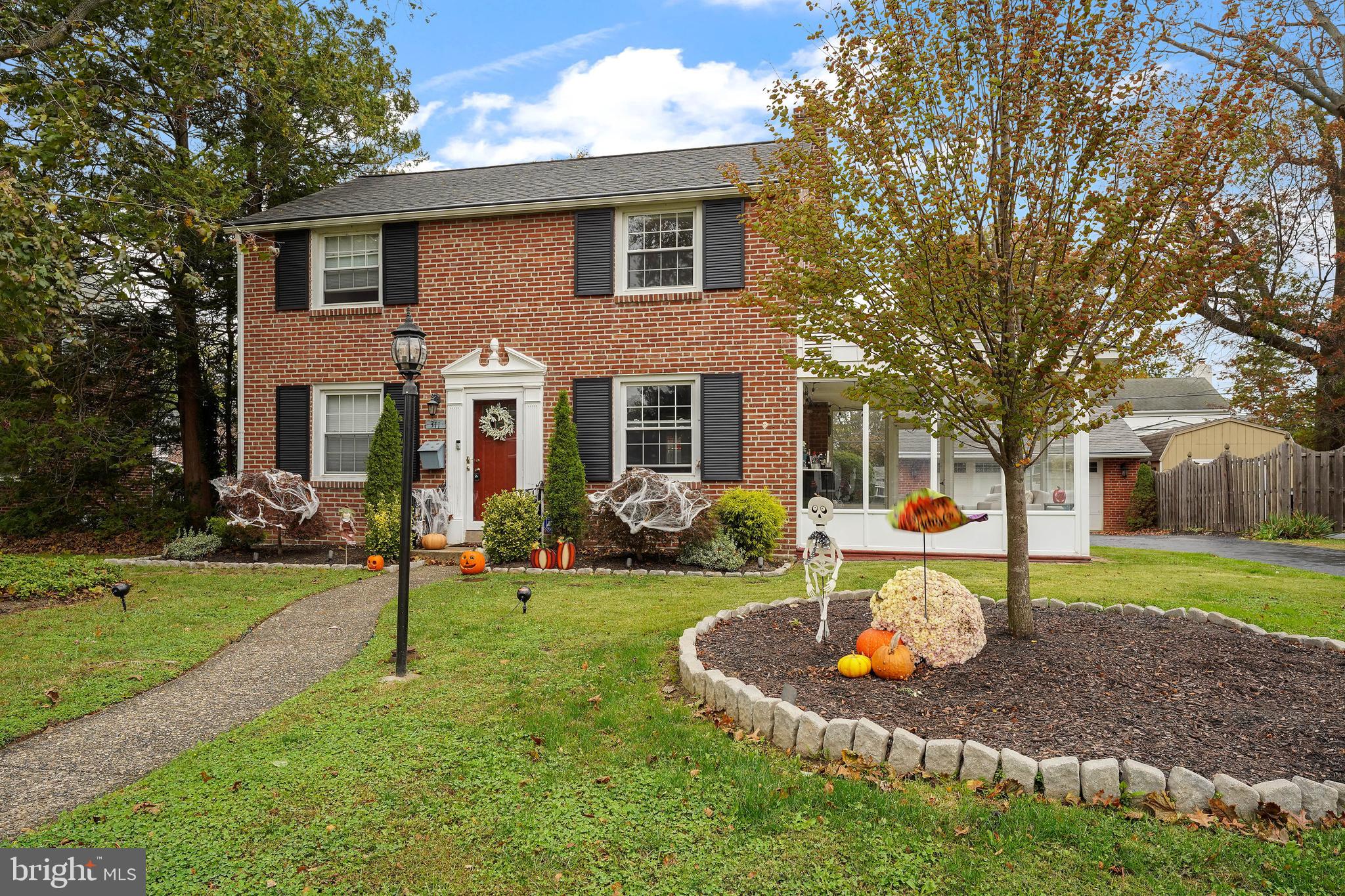 311 Avon Road Springfield, PA 19064 - Photo 37 of 38 a front view of a house with a yard table and chairs