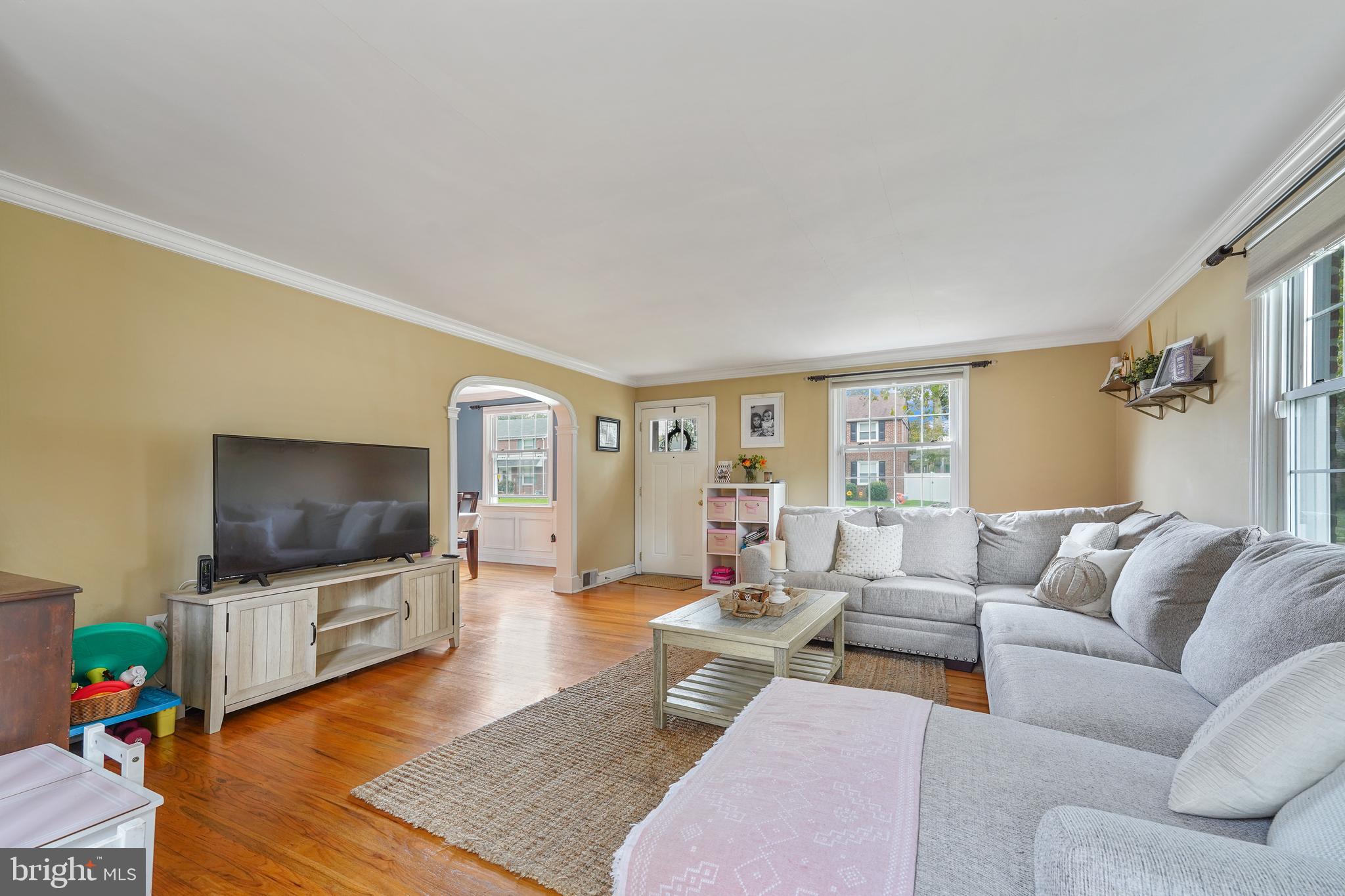 311 Avon Road Springfield, PA 19064 - Photo 5 of 38 a living room with furniture and a flat screen tv