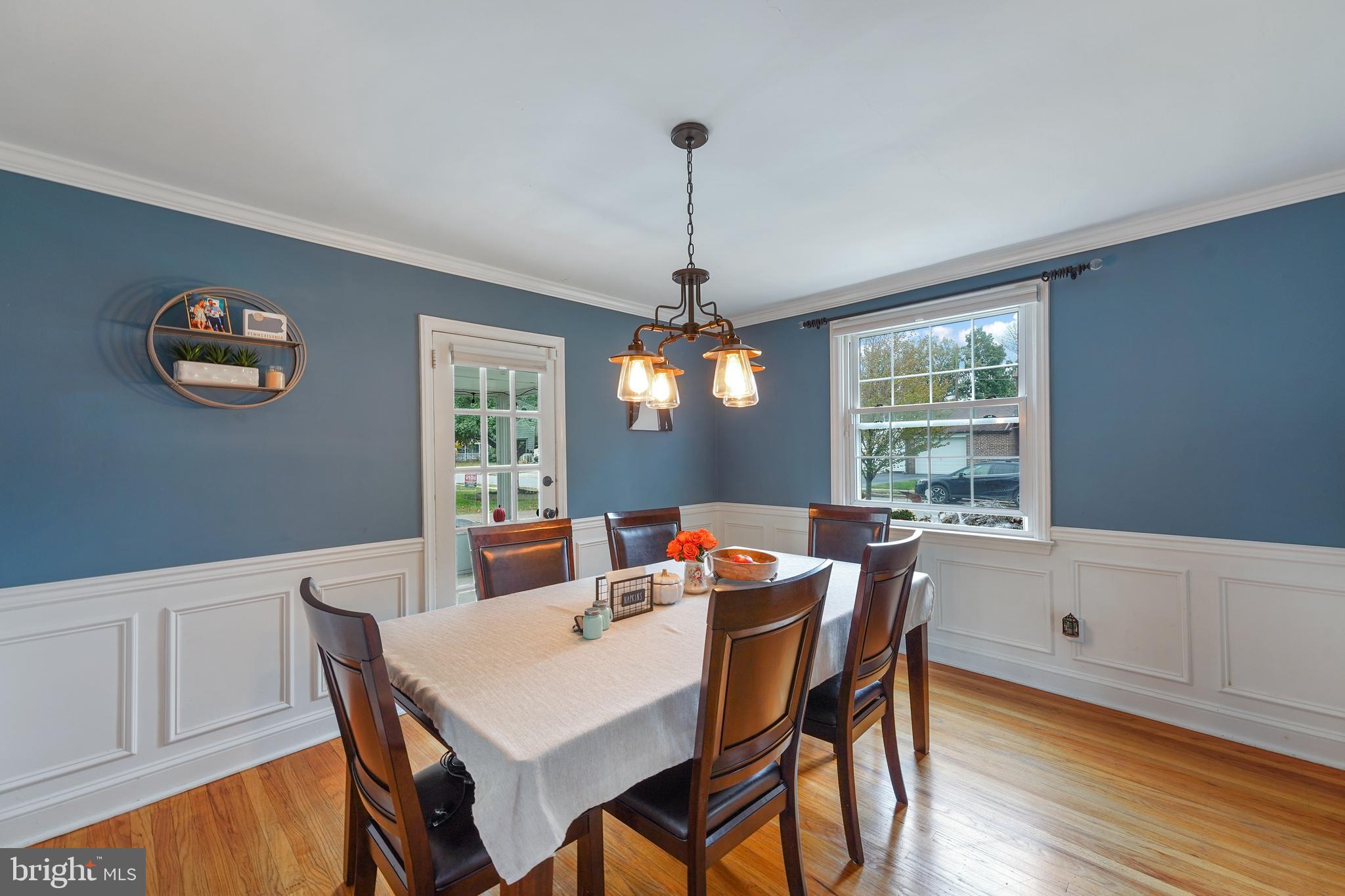 311 Avon Road Springfield, PA 19064 - Photo 10 of 38 a dining room with furniture a window and wooden floor