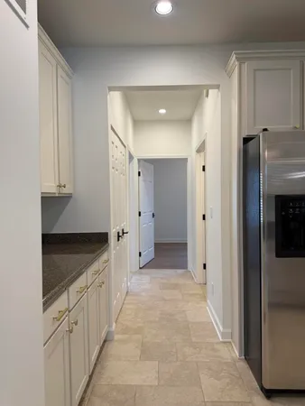 a spacious bathroom with a granite countertop sink