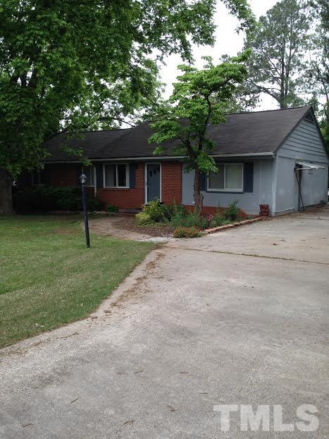 306 Wilmot Drive Raleigh, NC 27606 - Photo 1 of 10 a house with a tree in front of it