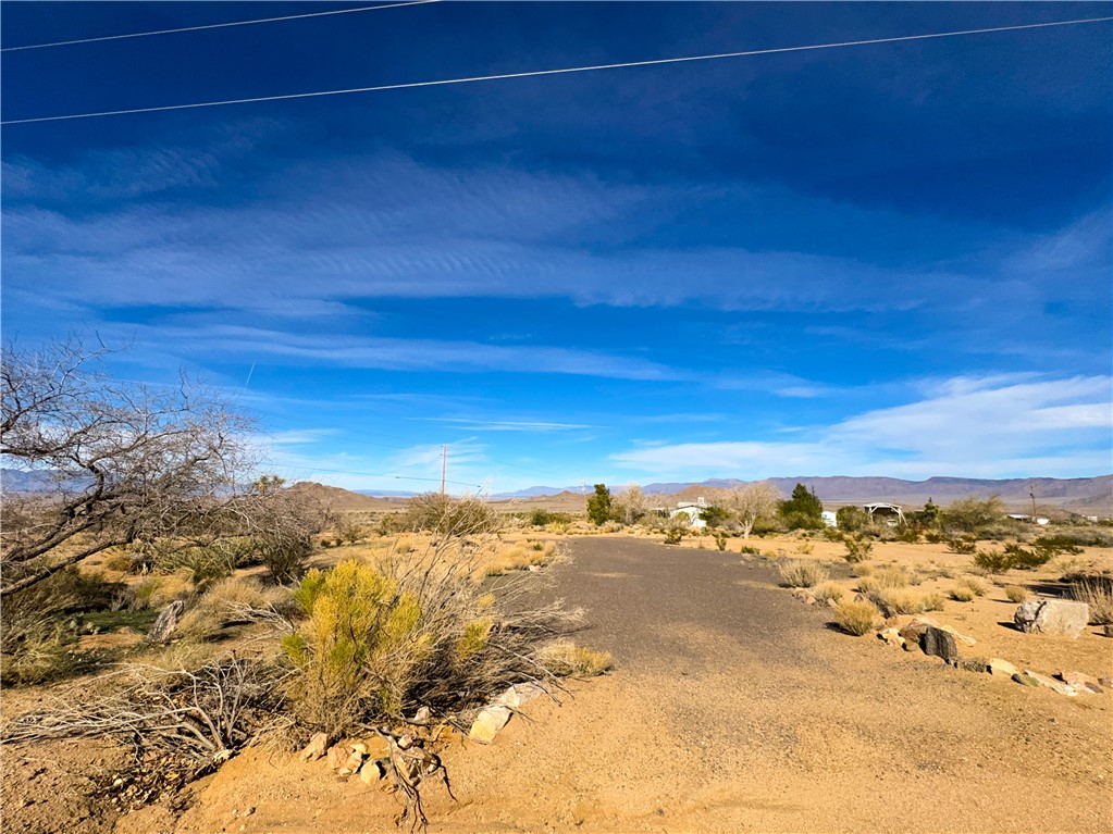 10210 Boulder Road Kingman, AZ 86401 - Photo 12 of 30 View of local wilderness featuring mountains and a desert landscape