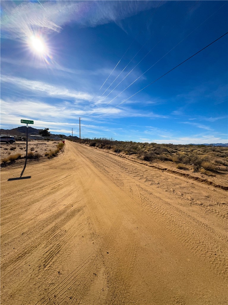 10210 Boulder Road Kingman, AZ 86401 - Photo 14 of 30 View of dirt / gravel road with a view of rural / pastoral area