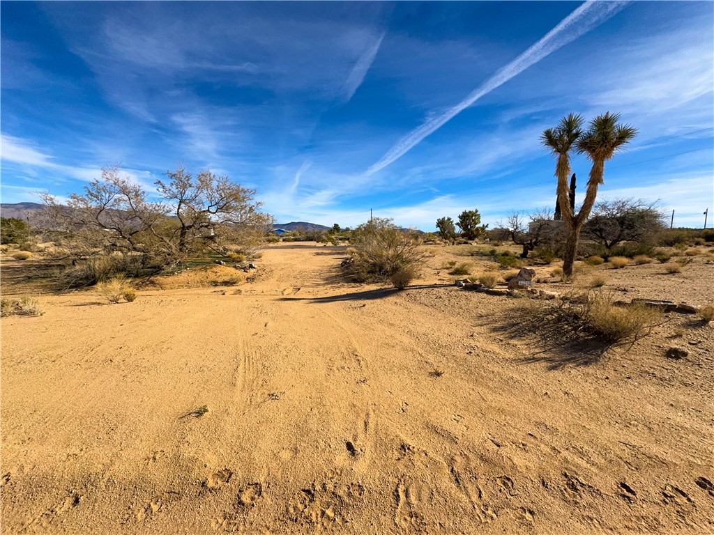 10210 Boulder Road Kingman, AZ 86401 - Photo 18 of 30 View of yard with view of desert landscape and a view of rural / pastoral area