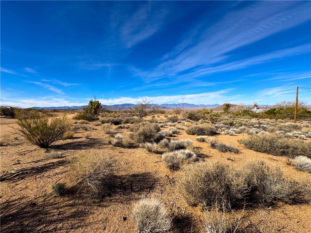 10210 Boulder Road Kingman, AZ 86401 - Photo 5 of 30 View of undeveloped land with a desert landscape and mountains