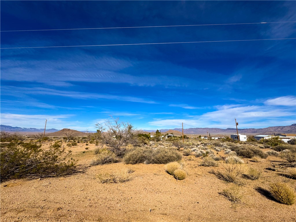 10210 Boulder Road Kingman, AZ 86401 - Photo 6 of 30 View of undeveloped land with mountains and a desert landscape