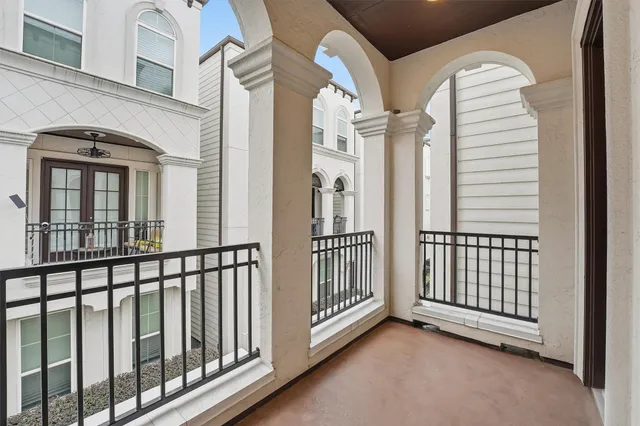 a view of a balcony with a white door