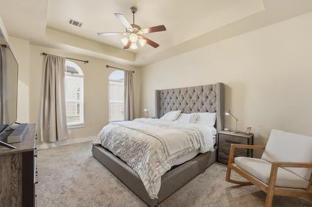 a bed room with a bed and a couch