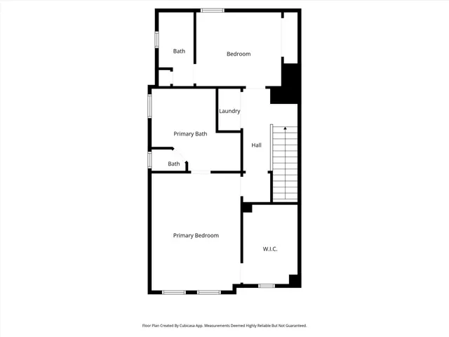 a picture of a bench in front of a building