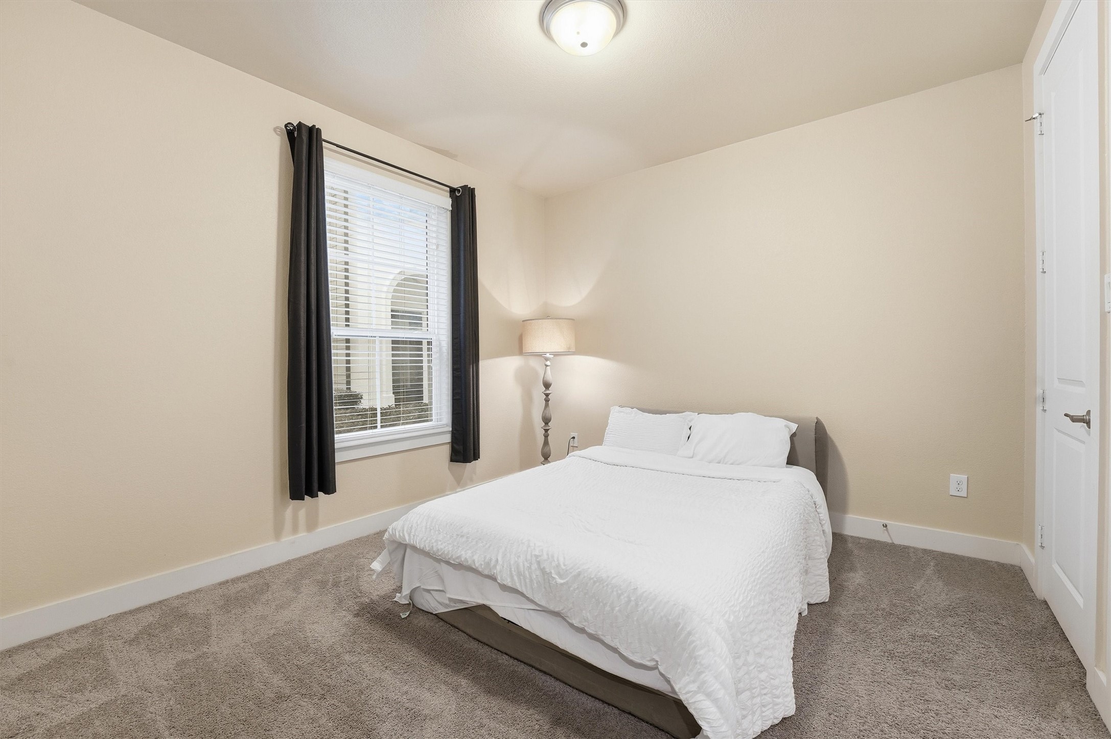 2714 Freund Street Houston, TX 77003 - Photo 25 of 29 a bedroom with a bed and a window