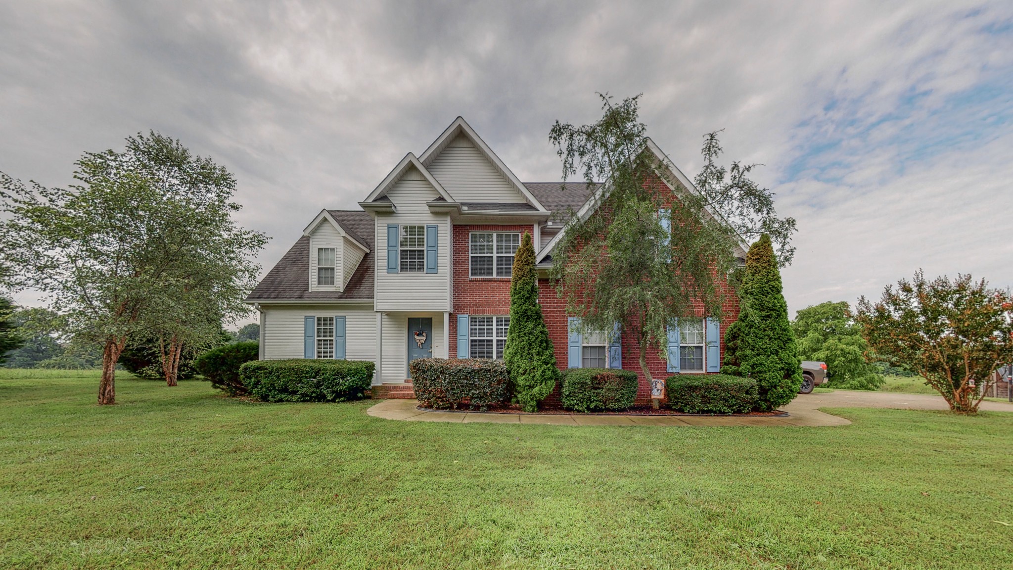2981 Lewis Road Santa Fe, TN 38482 - Photo 1 of 32 a front view of a house with a garden