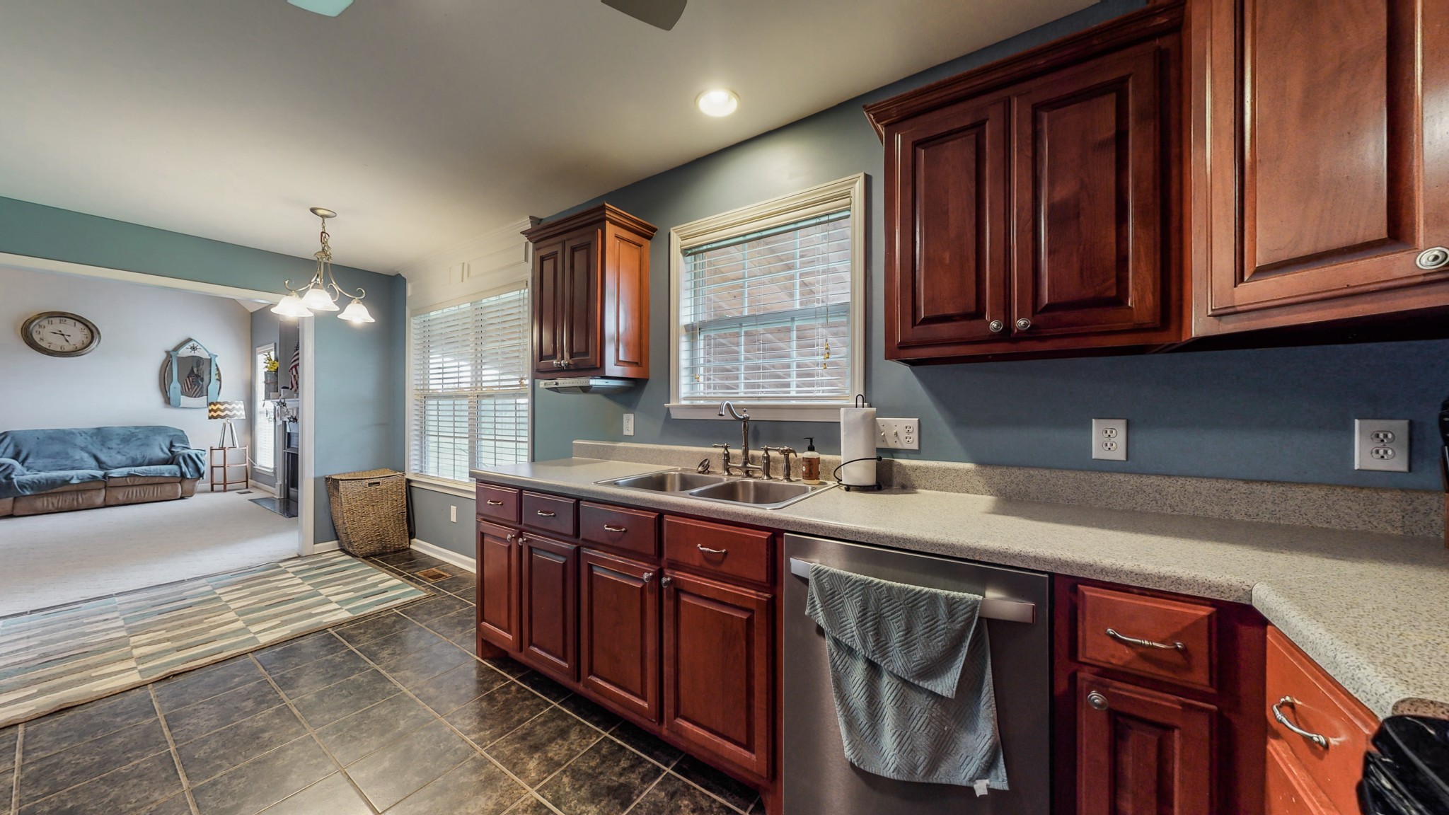 2981 Lewis Road Santa Fe, TN 38482 - Photo 12 of 32 a kitchen with stainless steel appliances granite countertop wooden cabinets a sink and dishwasher