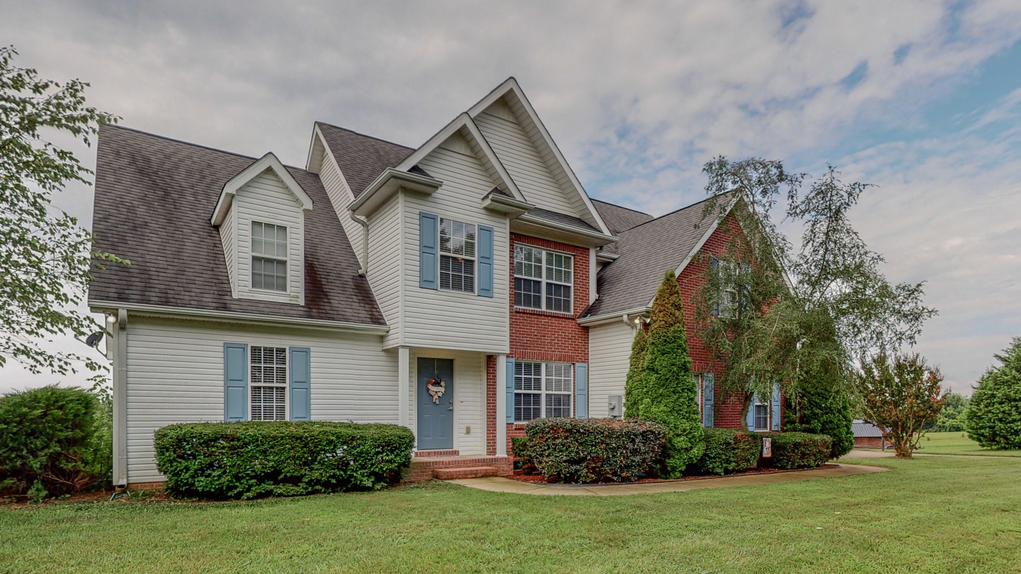 2981 Lewis Road Santa Fe, TN 38482 - Photo 5 of 32 a front view of a house with a garden