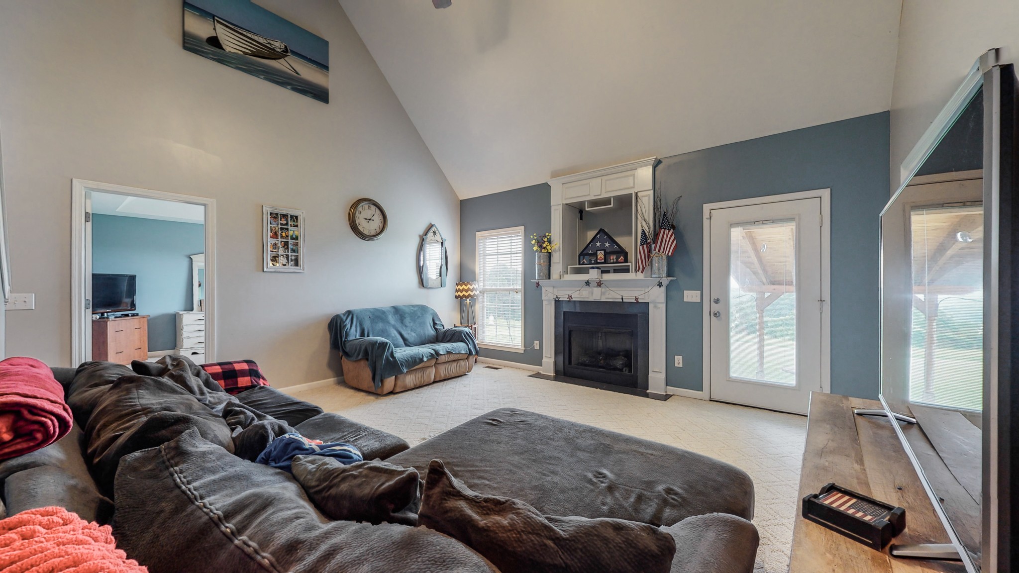 2981 Lewis Road Santa Fe, TN 38482 - Photo 8 of 32 a bedroom with a bed and a fireplace