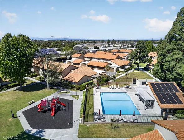 an aerial view of a house with outdoor space pool seating area and barbeque oven