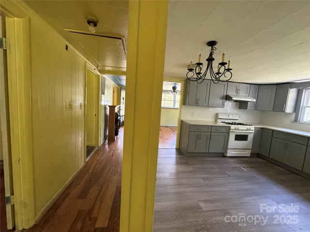 a kitchen with a refrigerator and a sink