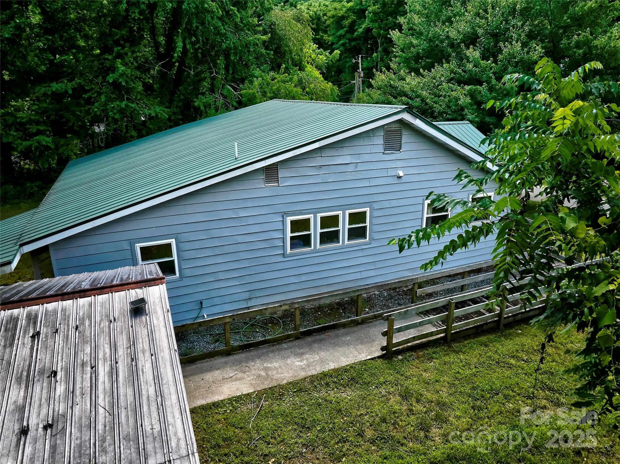 111 Kenneth Cooper Road Whittier, NC 28789 - Photo 15 of 30 a backyard of a house with lots of green space