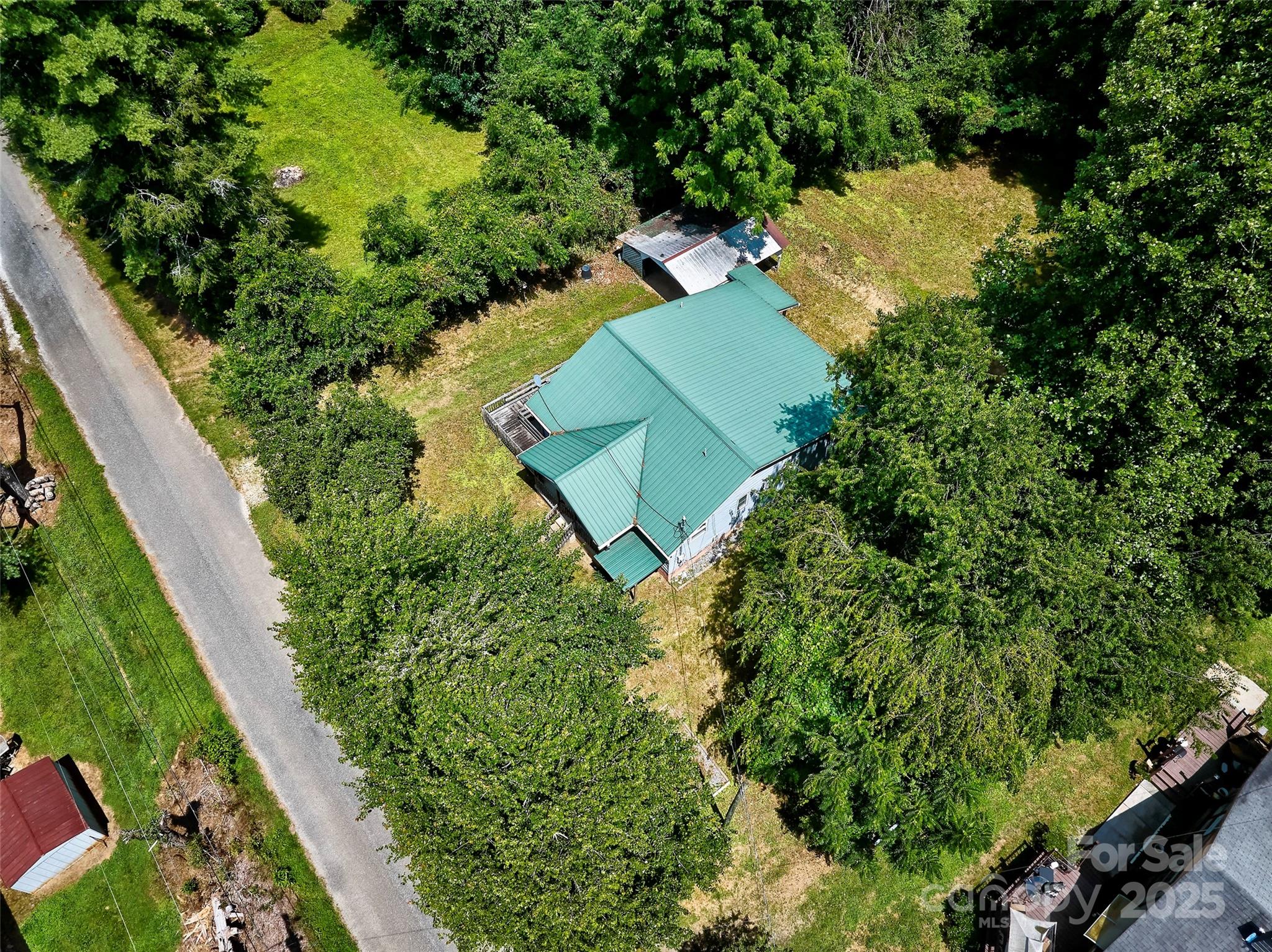 111 Kenneth Cooper Road Whittier, NC 28789 - Photo 4 of 30 an aerial view of a house